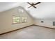 A view of the bedroom with a ceiling fan and three windows allowing natural light at 1905 Mckinley St, Clearwater, FL 33765