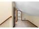 A view of the upstairs hallway with wood trim and beige colored walls at 1905 Mckinley St, Clearwater, FL 33765