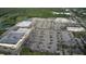 Aerial shot of local shopping centers and large parking area filled with cars at 2113 Golf Manor Blvd, Valrico, FL 33596