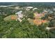 Aerial view of multiple community baseball fields surrounded by mature trees and a swimming pool at 2113 Golf Manor Blvd, Valrico, FL 33596