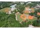 Aerial view of community baseball fields, a swimming pool and mature trees at 2113 Golf Manor Blvd, Valrico, FL 33596