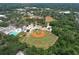 Aerial view of community baseball fields surrounded by lush greenery and mature trees at 2113 Golf Manor Blvd, Valrico, FL 33596