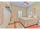 Comfortable bedroom with wood floors, neutral colors, and ample natural light at 2113 Golf Manor Blvd, Valrico, FL 33596