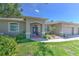 Lovely home with well-maintained landscaping and an inviting covered entrance at 2113 Golf Manor Blvd, Valrico, FL 33596