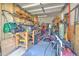 View of garage with tools, lawn mowers, and other equipment used for home maintenance at 2113 Golf Manor Blvd, Valrico, FL 33596