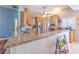 Open kitchen design with breakfast bar, stainless appliances, and custom cabinets at 2113 Golf Manor Blvd, Valrico, FL 33596