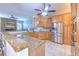 Stylish kitchen boasting granite counters and stainless steel appliances at 2113 Golf Manor Blvd, Valrico, FL 33596