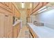 Functional laundry room with ample cabinet space, countertop, and washer/dryer appliances at 2113 Golf Manor Blvd, Valrico, FL 33596