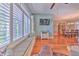 Inviting living room featuring large window seat and hardwood floors at 2113 Golf Manor Blvd, Valrico, FL 33596