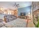 Spacious living room with fireplace, hardwood floors, and ample seating at 2113 Golf Manor Blvd, Valrico, FL 33596