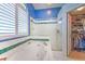 Main bathroom with walk in shower, soaking tub and access to a walk-in closet at 2113 Golf Manor Blvd, Valrico, FL 33596