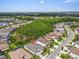 Aerial view showing the home's location within a vibrant community, close to green spaces and convenient roadways at 2165 Hollow Forest Ct, Wesley Chapel, FL 33543