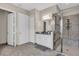 Bathroom boasts dual sink vanity, large shower, and neutral wall color at 2165 Hollow Forest Ct, Wesley Chapel, FL 33543