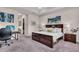 Comfortable bedroom features soft carpeting and neutral wall color at 2165 Hollow Forest Ct, Wesley Chapel, FL 33543