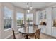 Cozy breakfast nook with large windows and views of the home's exterior at 2165 Hollow Forest Ct, Wesley Chapel, FL 33543