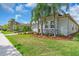 Attractive home featuring a lush lawn, mature landscaping, and a paver driveway at 2165 Hollow Forest Ct, Wesley Chapel, FL 33543