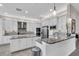 Modern kitchen boasts stainless steel appliances, granite counters, and ample cabinet space at 2165 Hollow Forest Ct, Wesley Chapel, FL 33543
