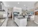 Bright kitchen boasts granite countertops, stainless steel appliances, and tile flooring at 2165 Hollow Forest Ct, Wesley Chapel, FL 33543