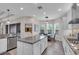 Kitchen featuring white cabinets, granite countertops, and a central island with seating at 2165 Hollow Forest Ct, Wesley Chapel, FL 33543