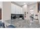 Kitchen area boasts granite countertops, modern appliances, and bright cabinetry at 2165 Hollow Forest Ct, Wesley Chapel, FL 33543