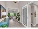 Open-concept living space with abundant natural light, stylish decor, and tiled flooring at 2165 Hollow Forest Ct, Wesley Chapel, FL 33543