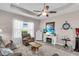 Inviting living room features a cozy shag rug, fireplace, and comfortable leather seating at 2165 Hollow Forest Ct, Wesley Chapel, FL 33543