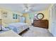 Bright bedroom with warm yellow walls, carpet, ample natural light, and stylish furnishings at 2501 Crescent Dr, Largo, FL 33770