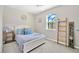 Comfortable bedroom featuring a full bed, neutral tones, and natural light, creating a peaceful and relaxing space at 2511 Early Dawn Ct, Valrico, FL 33594