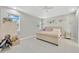 Bedroom with vaulted ceiling, neutral walls, large bed, and bright natural light at 2511 Early Dawn Ct, Valrico, FL 33594