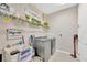 Laundry room featuring modern machines and decor at 2511 Early Dawn Ct, Valrico, FL 33594
