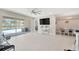 Open-concept living room with tile flooring that flows into the dining area, perfect for entertaining at 2511 Early Dawn Ct, Valrico, FL 33594
