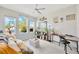 Bright living room with large windows, comfortable seating, and natural decor at 2511 Early Dawn Ct, Valrico, FL 33594