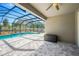Screened-in pool area featuring a beautiful in-ground pool and gray brick patio space at 2511 Early Dawn Ct, Valrico, FL 33594