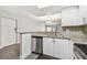 Updated kitchen with granite countertops, stainless steel appliances and white cabinets at 2650 Countryside Blvd # C203, Clearwater, FL 33761