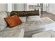 Comfortable couch in a well-lit living room with an open floorplan and neutral color palette at 2650 Countryside Blvd # C203, Clearwater, FL 33761
