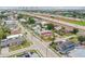 Aerial view featuring a charming two-story blue home with convenient access to nearby highways and urban amenities at 2704 W Main St, Tampa, FL 33607