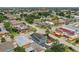 Aerial view of a charming two-story blue home nestled in a lively neighborhood with nearby local attractions at 2704 W Main St, Tampa, FL 33607