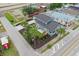 Aerial view of a charming two-story blue home, showing its spacious surroundings and convenient location at 2704 W Main St, Tampa, FL 33607