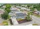 Aerial view of a two-story blue home, showcasing its surrounding neighborhood and proximity to local amenities at 2704 W Main St, Tampa, FL 33607