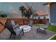 Cozy backyard with gravel, a modern fire pit, and comfortable Adirondack chairs at 2704 W Main St, Tampa, FL 33607
