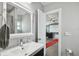 Bathroom view into a home theater room, featuring modern fixtures and gray paint at 2704 W Main St, Tampa, FL 33607