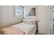 Cozy bedroom features a bed with decorative pillows and a Zebra wall art piece at 2704 W Main St, Tampa, FL 33607