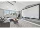 Bright home theater features a large projection screen and multiple windows at 2704 W Main St, Tampa, FL 33607