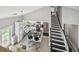 Aerial view of a modern kitchen with island, stainless steel appliances, and black and white stairs at 2704 W Main St, Tampa, FL 33607