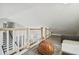 Cozy loft area featuring a cozy bean bag with view to the black-and-white stairwell at 2704 W Main St, Tampa, FL 33607