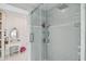 Glass enclosed shower with gray tilework and modern fixtures at 2704 W Main St, Tampa, FL 33607