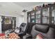 Home theater with a mini bar, recliners, film projector and custom display cabinets at 2704 W Main St, Tampa, FL 33607