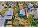 Aerial view of the property with a cozy backyard fire pit and lush tropical landscaping at 2909 60Th N Ave, St Petersburg, FL 33714
