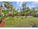 Fully fenced backyard complete with a fire pit, mature landscaping, and plenty of space for outdoor activities at 2909 60Th N Ave, St Petersburg, FL 33714