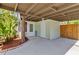 Under-cover parking space featuring additional secure storage and landscaping at 2909 60Th N Ave, St Petersburg, FL 33714